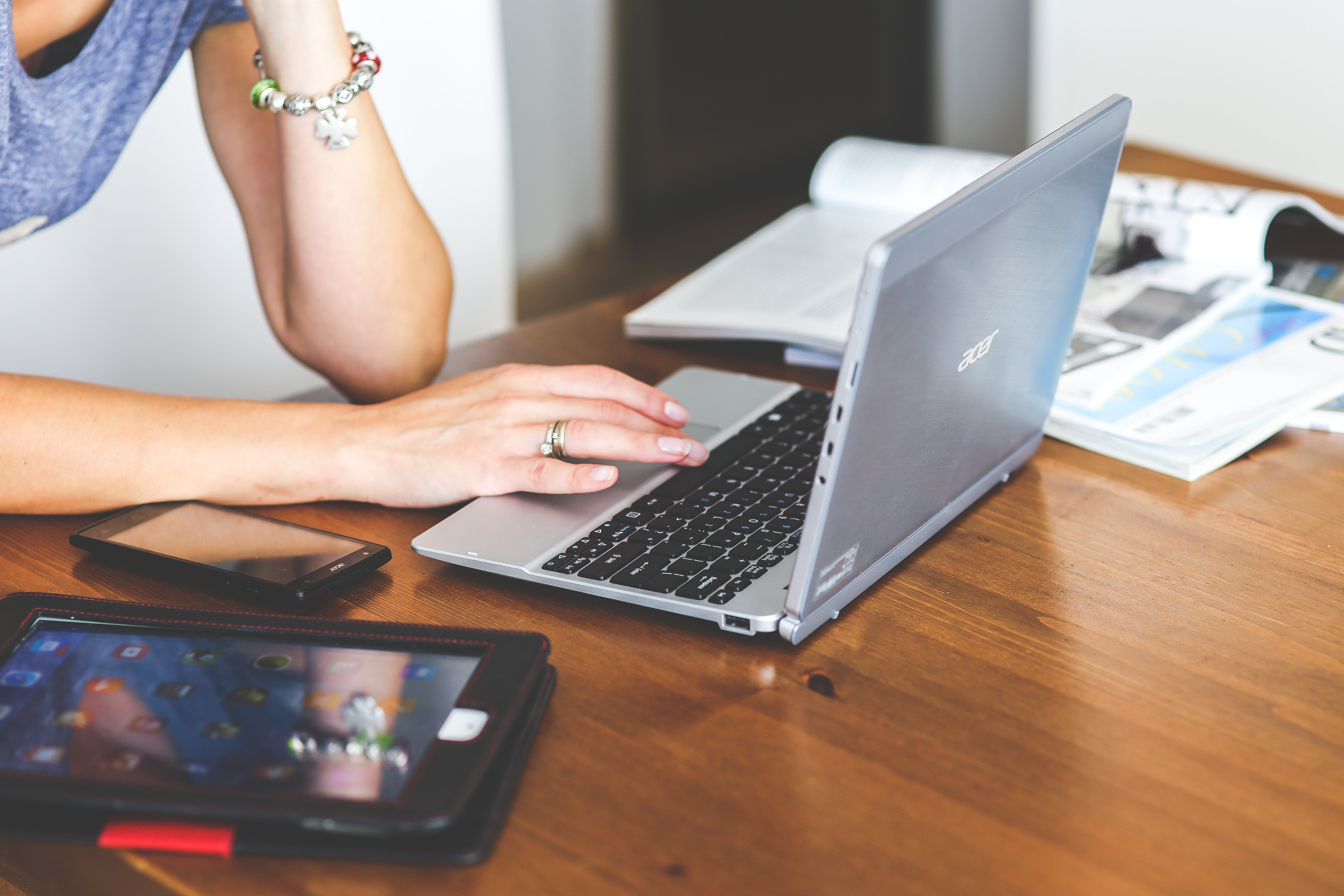 woman-hand-smartphone-laptop.jpg