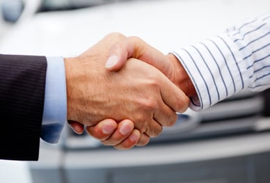 Business handshake to close the deal after buying a car-1