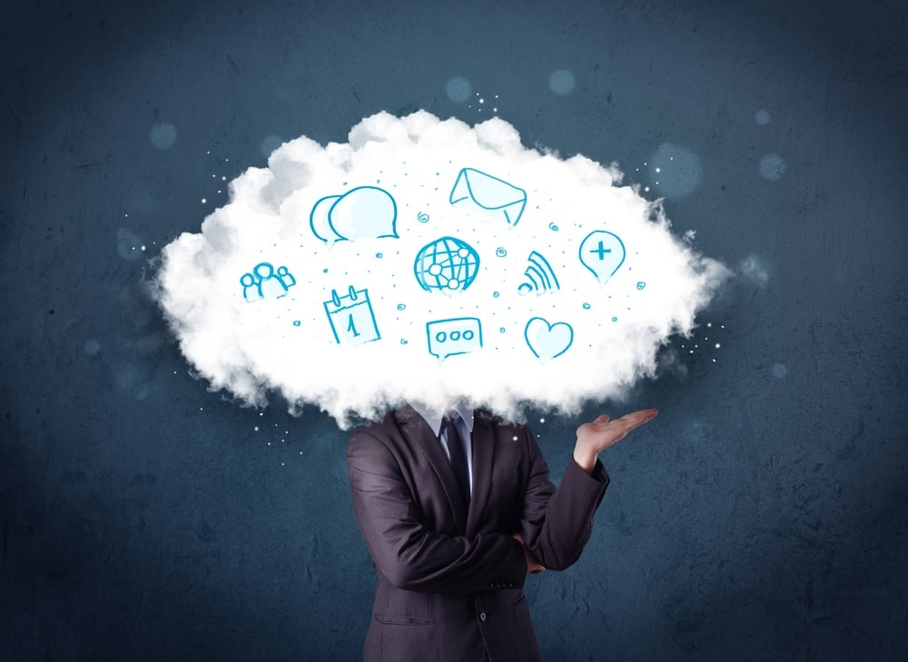 Man in suit with cloud head and blue icons on grungy background
